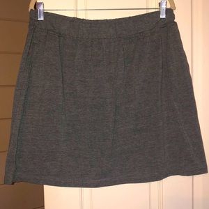Woman Within Gray Skort